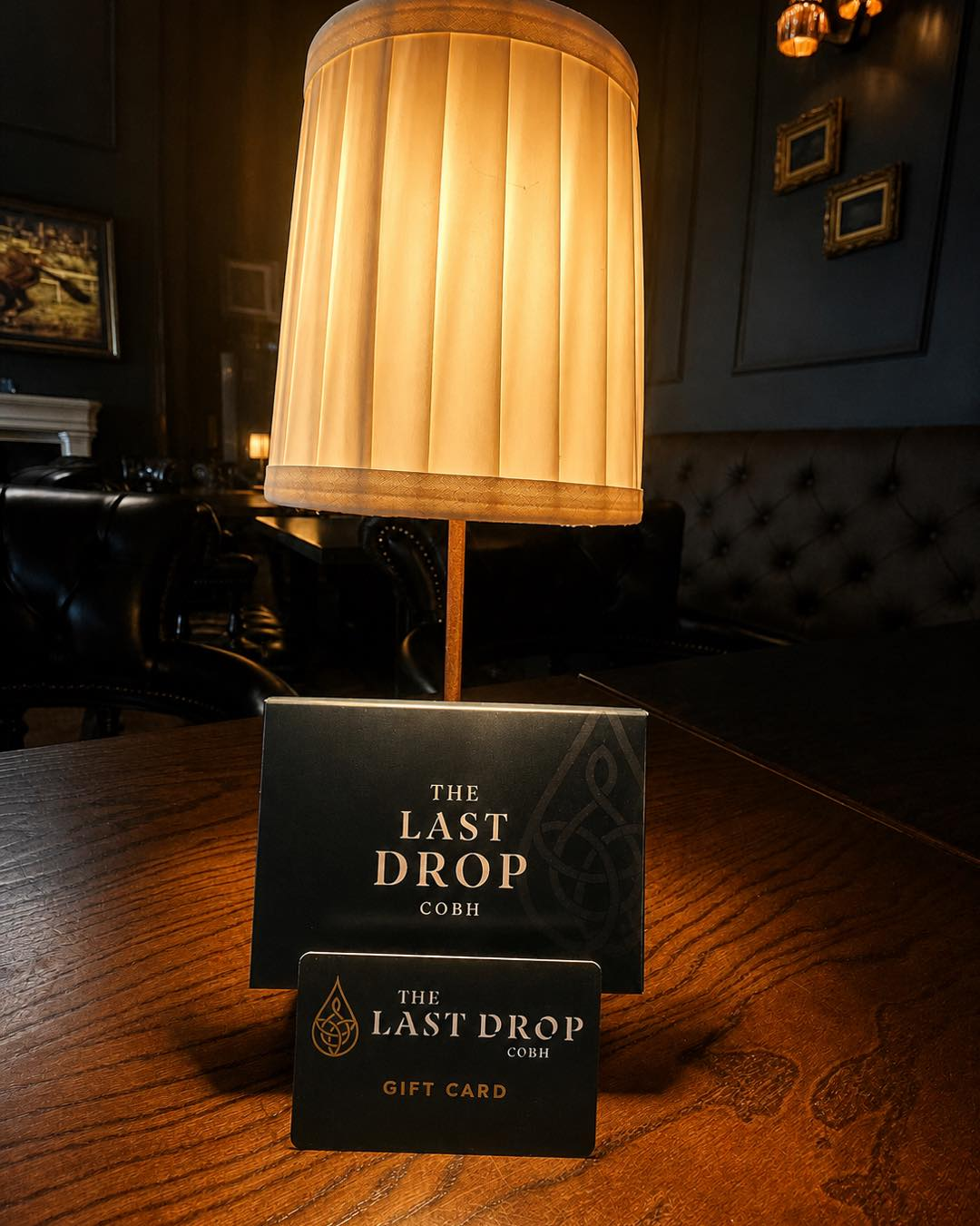 Lamplit panelled interior at The Last Drop, Cobh