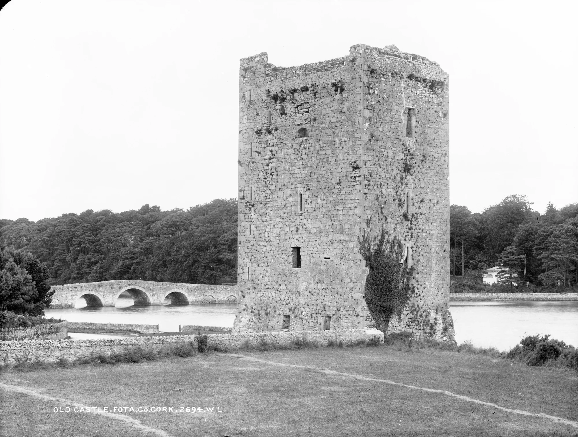 Belvelly Castle standing as a roofless ruin beside the bridge in a Victorian photograph