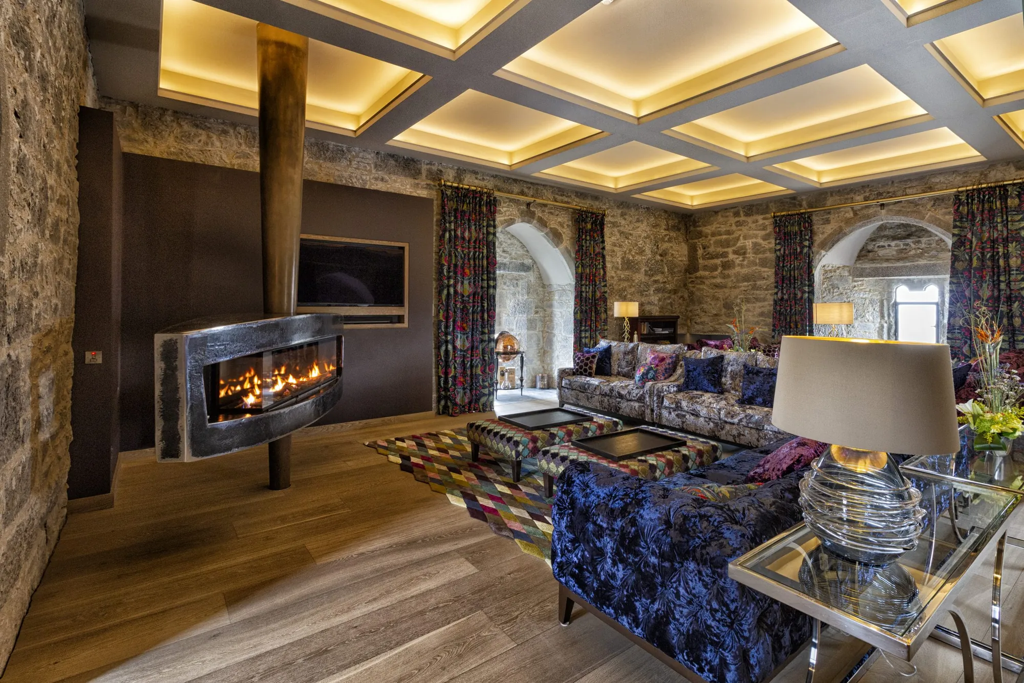 The restored drawing room at Belvelly Castle with its fire lit
